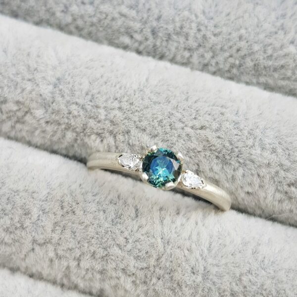 clawcup trilogy blue green sapphire with pear diamond