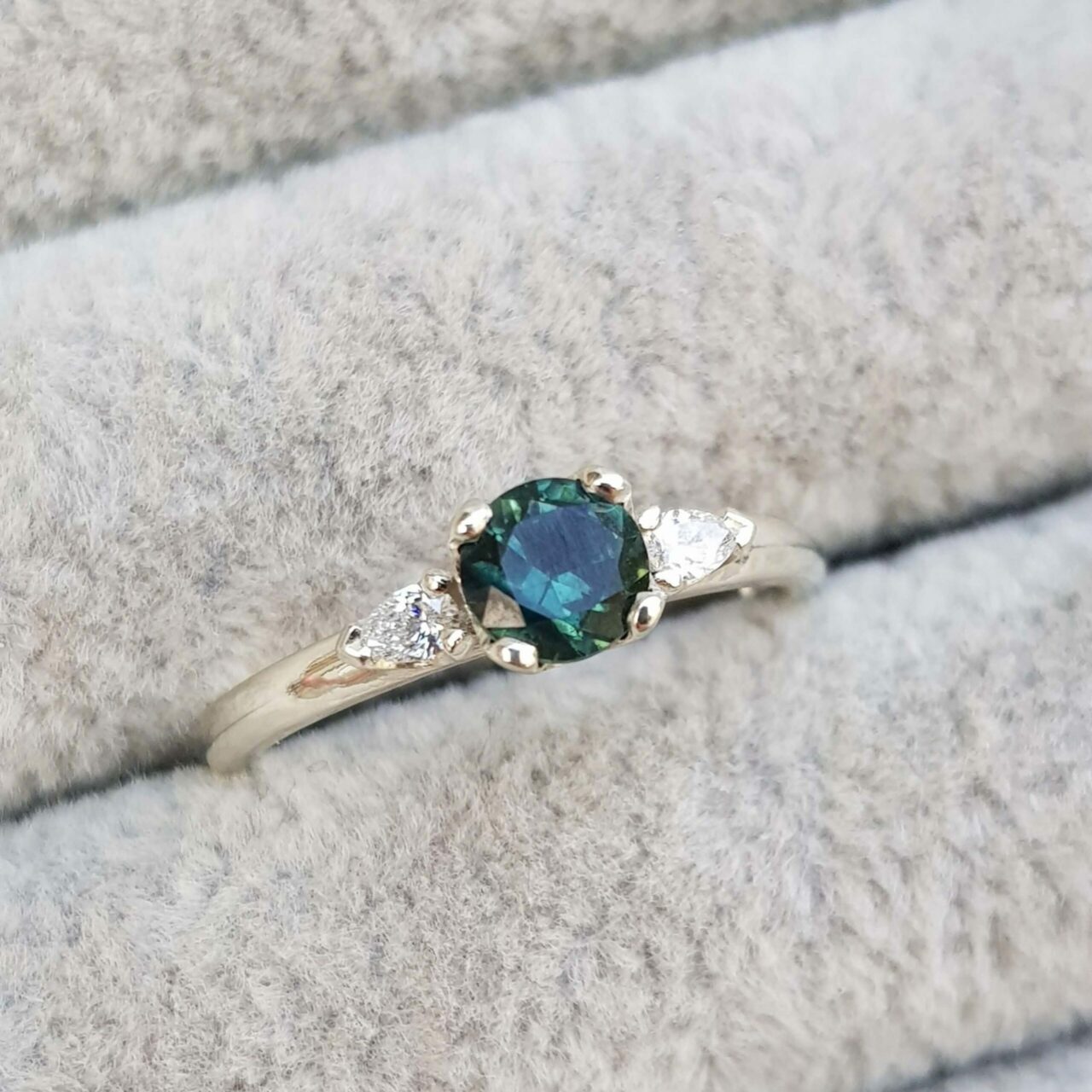 Teal Sapphire Trilogy Engagement Ring with Pear Diamonds