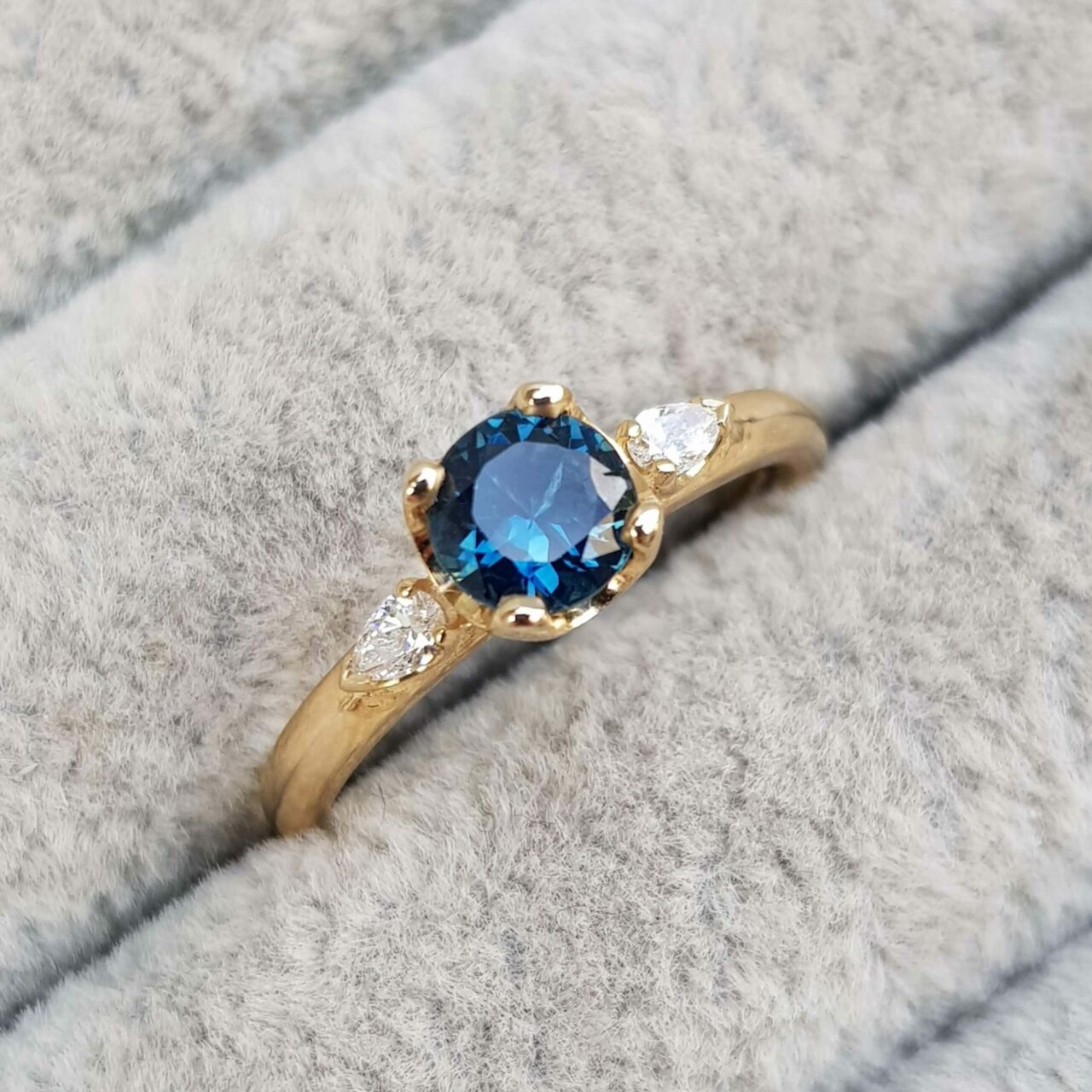 Blue Sapphire and Diamond Trilogy Engagement Ring
