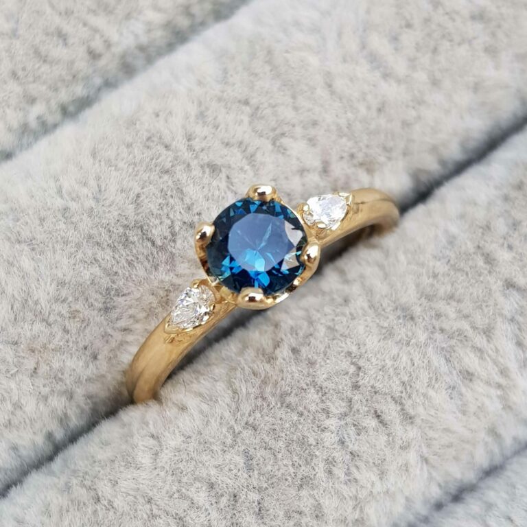 Blue Sapphire and Diamond Trilogy Engagement Ring