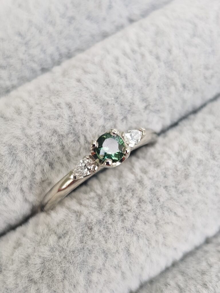 Teal Sapphire and Pear Diamonds Trilogy Engagement Ring