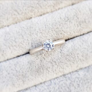 Round diamond solitaire claw cups engagement ring