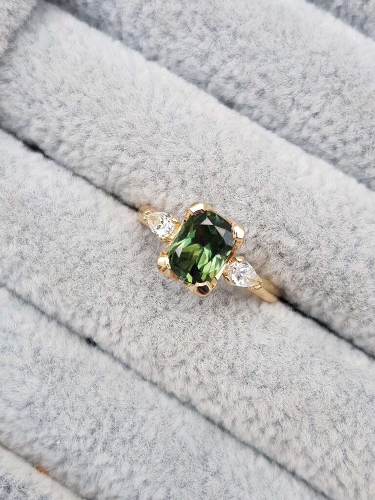green sapphire trilogy engagement ring