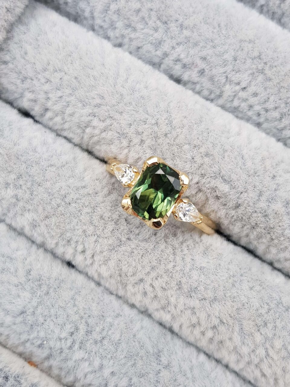 green sapphire trilogy engagement ring