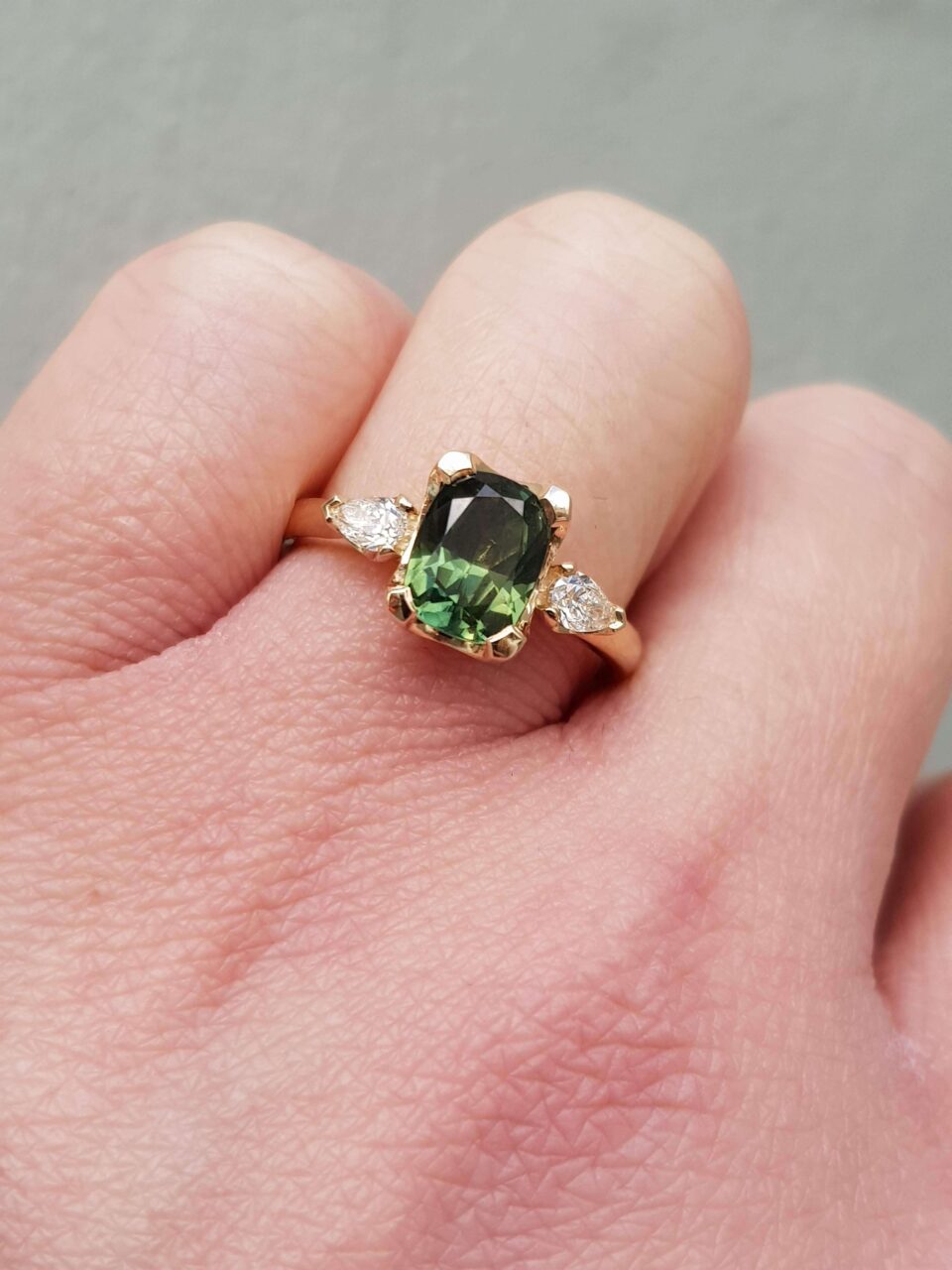 green sapphire trilogy engagement ring