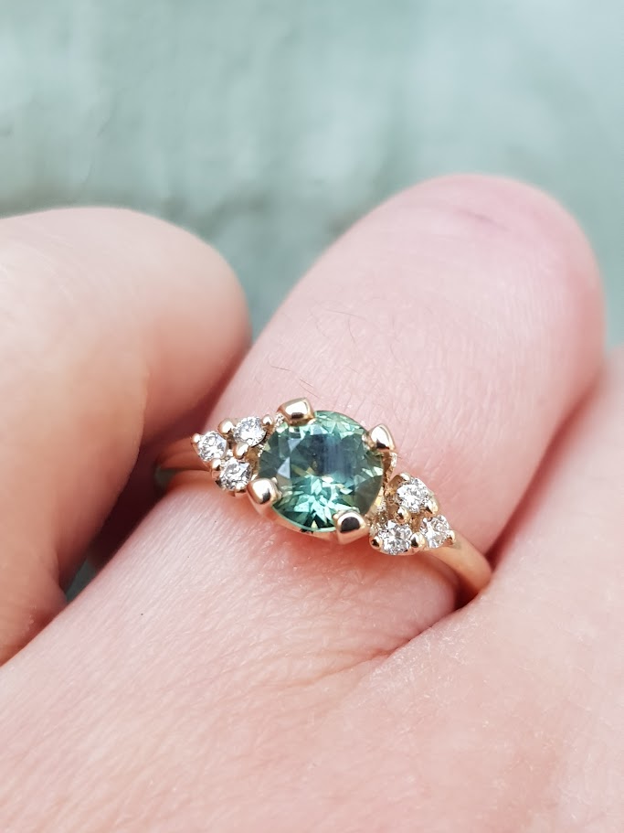 Green Sapphire With Dimond Trios Engagement Ring