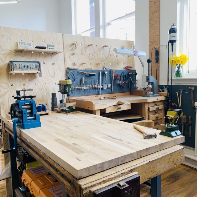 Jeweller's workbench with lots of jewellery making tools and machinery 