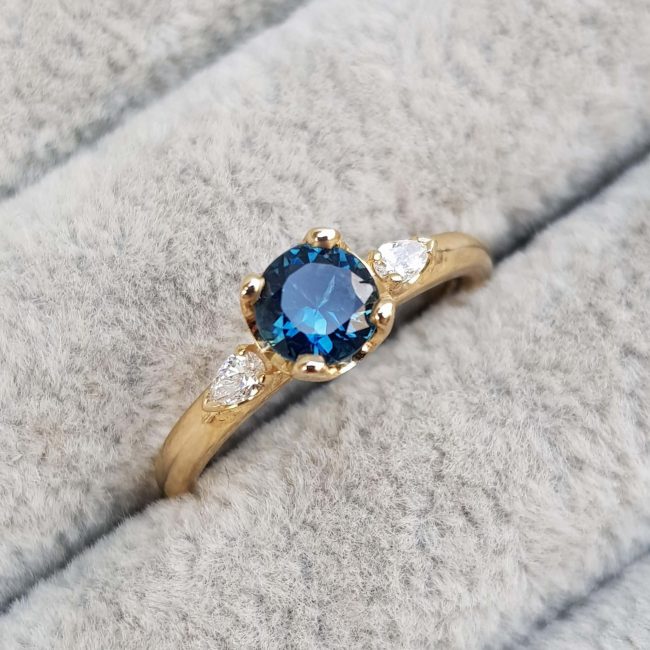 Blue Sapphire and Diamond Trilogy Engagement Ring