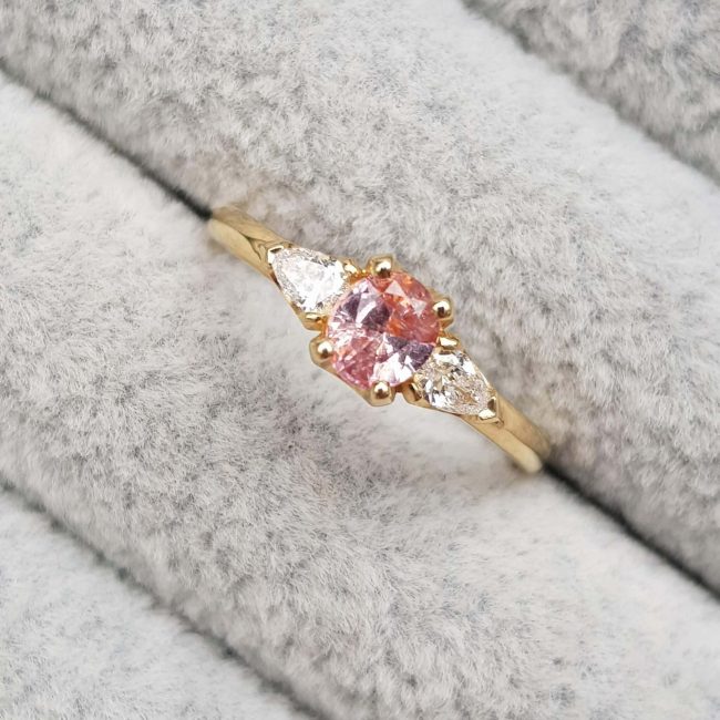 Peach Pink Oval Sapphire Diamond Trilogy Engagement Ring