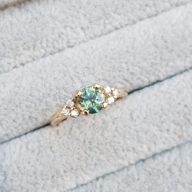 Green Sapphire With Dimond Trios Engagement Ring