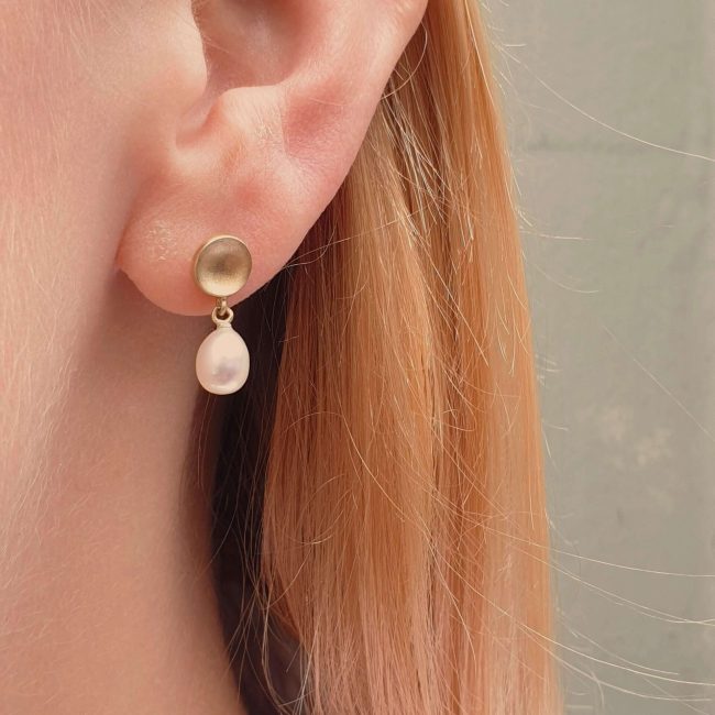 Based on our classic dome collection, these pearl drop dome earrings have been designed by Clifton Rocks founder Clare Chandler and feature a subtle dome design that is completed with a stunning pearl drop. This piece is an elegant addition to any bridal look and its timeless feel also makes it the perfect gift for your loved one.